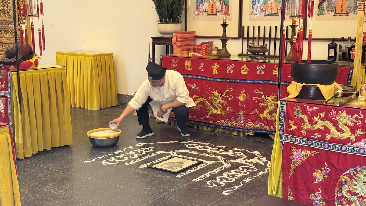 A Taoist ritual preparation scene for blessing talismans